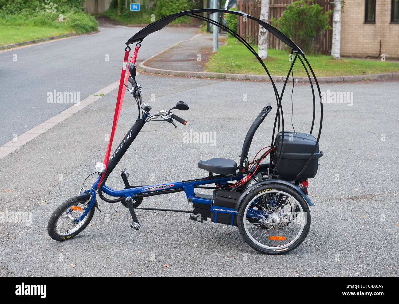 Justwin electric tricycle (trike), fitted with a rain canopy. The Justwin company is based in Taiwan Stock Photo