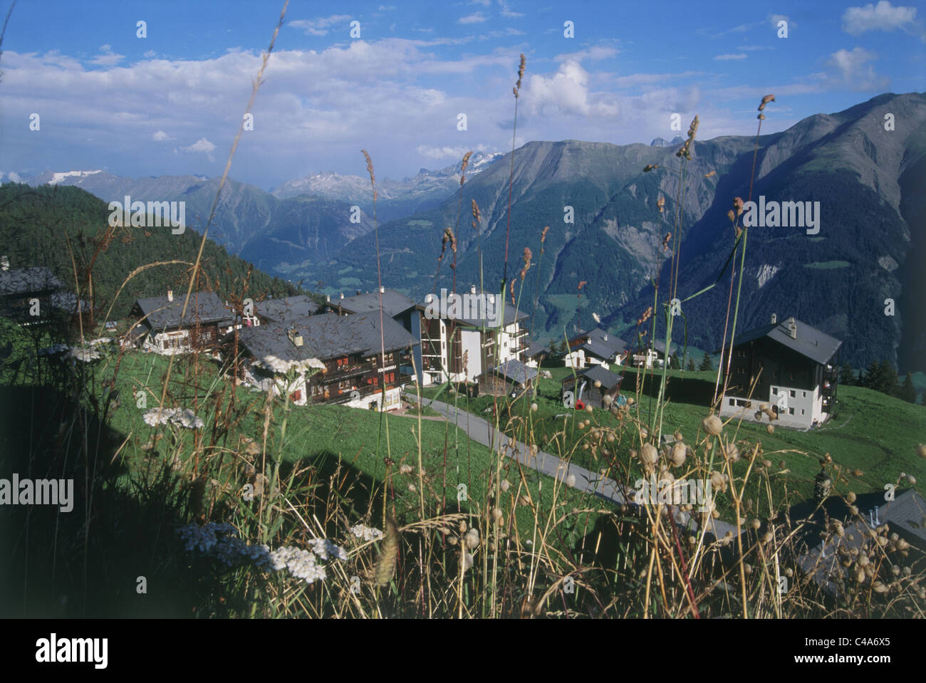 Photograph of a small village on the Alps Stock Photo - Alamy