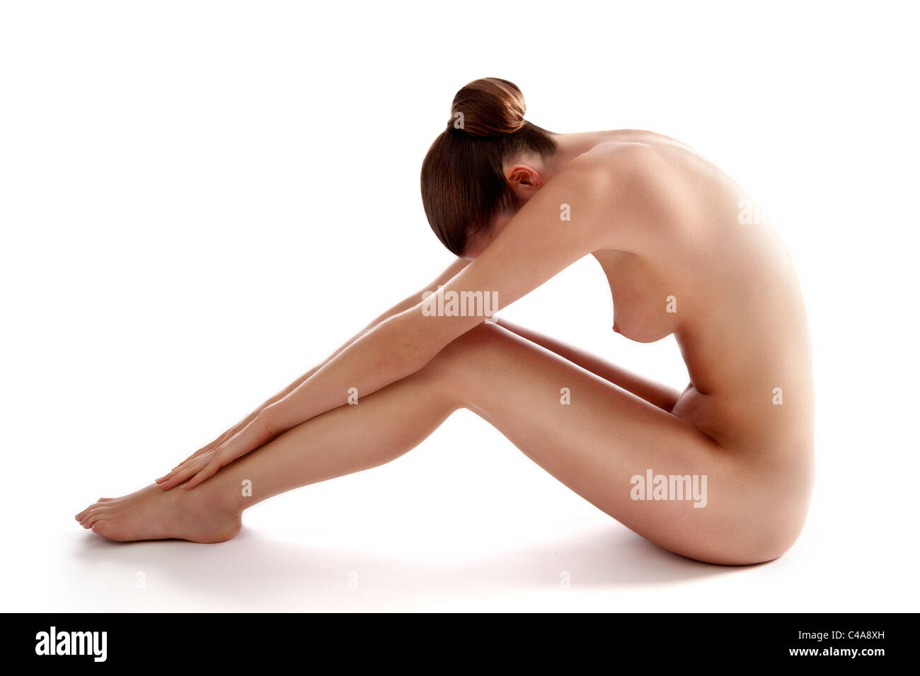 Jeune femme nue assise Stock Photo