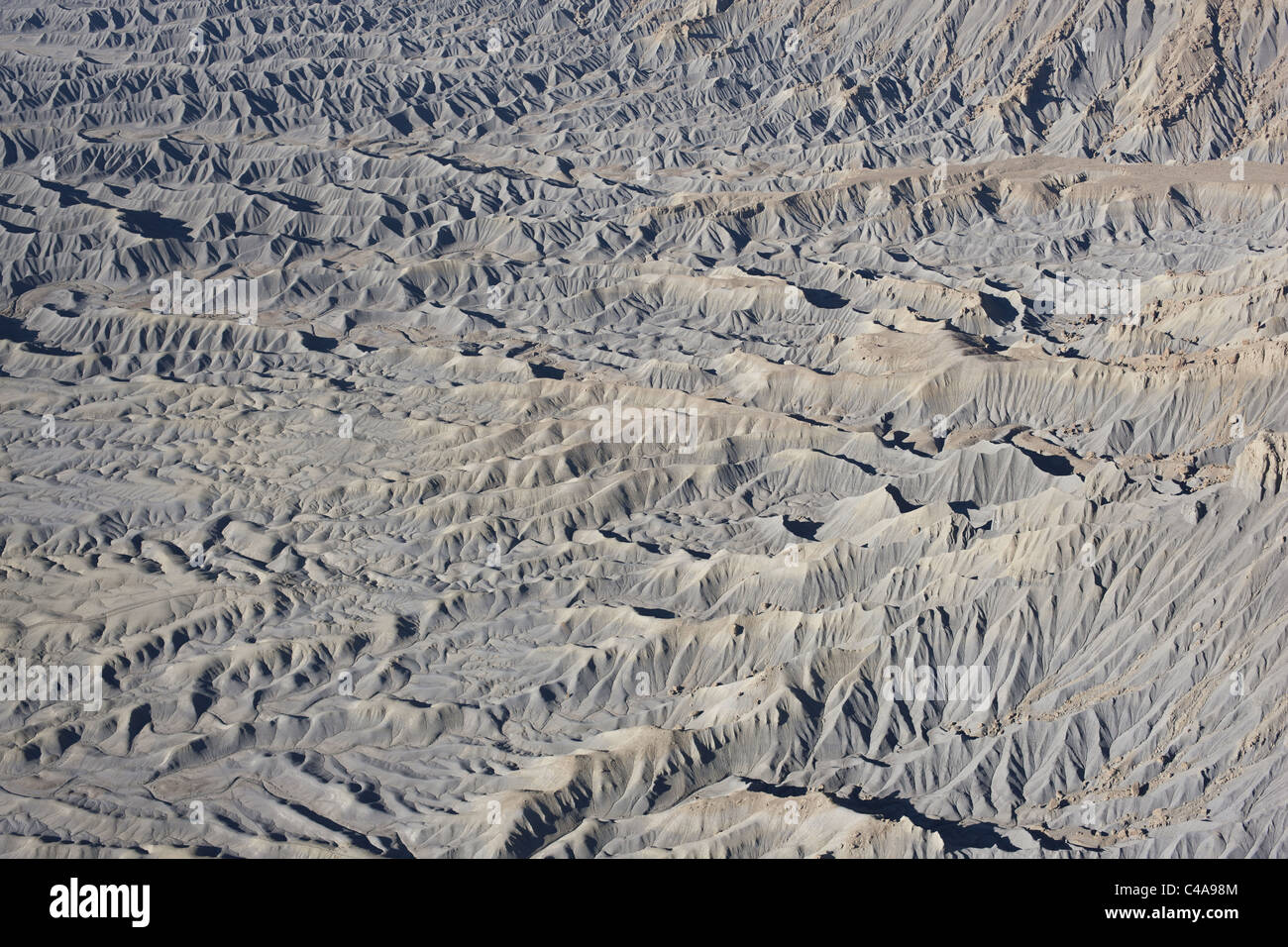 AERIAL VIEW. Badlands of Manco Shale. Near Caineville, Wayne County, Utah, USA. Stock Photo
