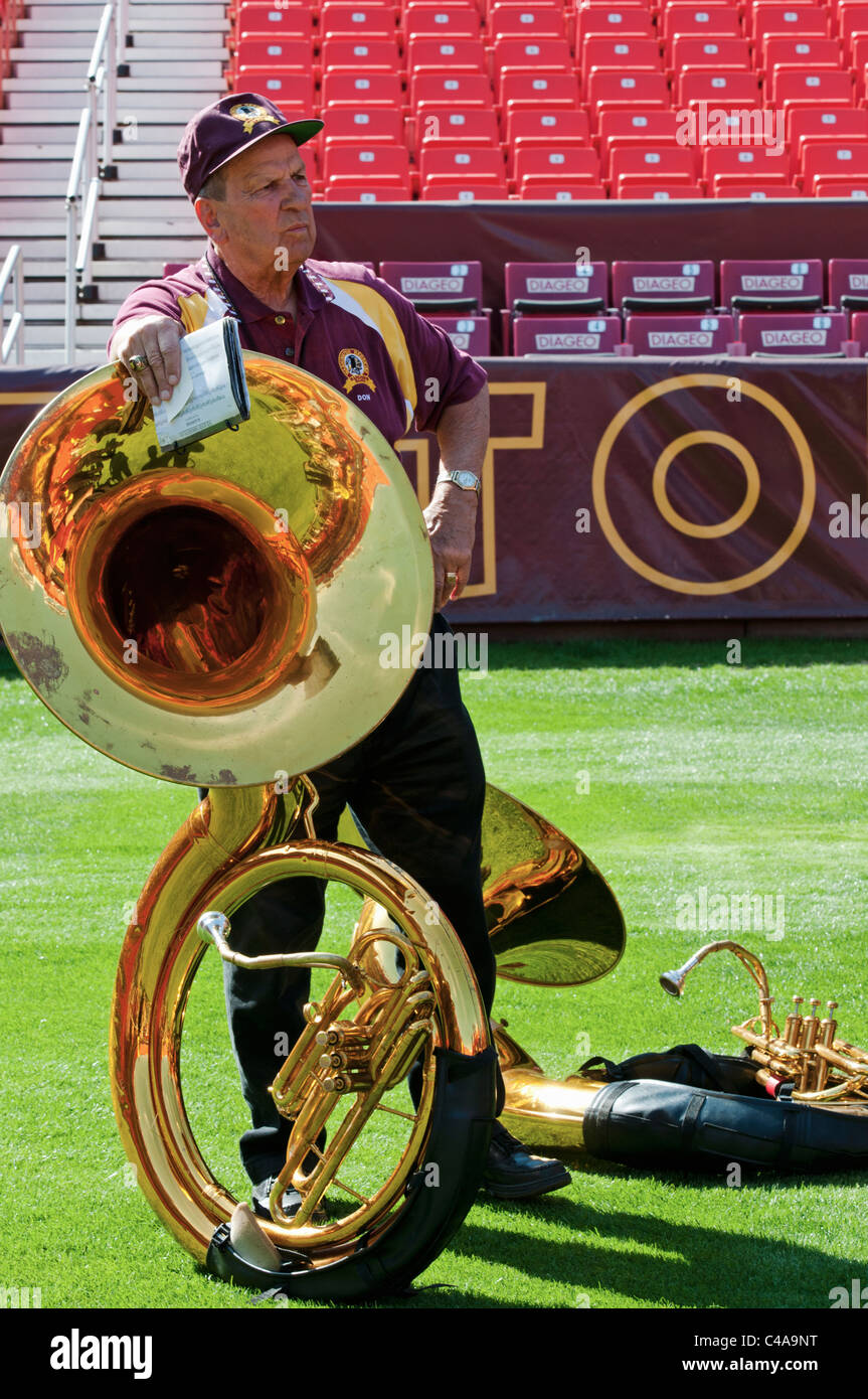 The Washington Redskins Marching Band takes a break and the tuba player looks on, FedEx Field in Landover Maryland Stock Photo