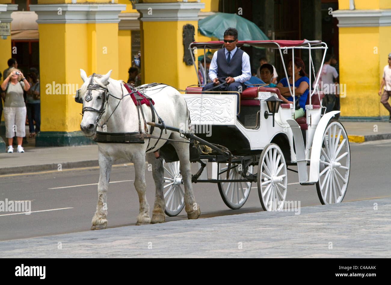 Horse drawn carriage at the Plaza Mayor or Plaza de Armas of Lima, Peru. Stock Photo