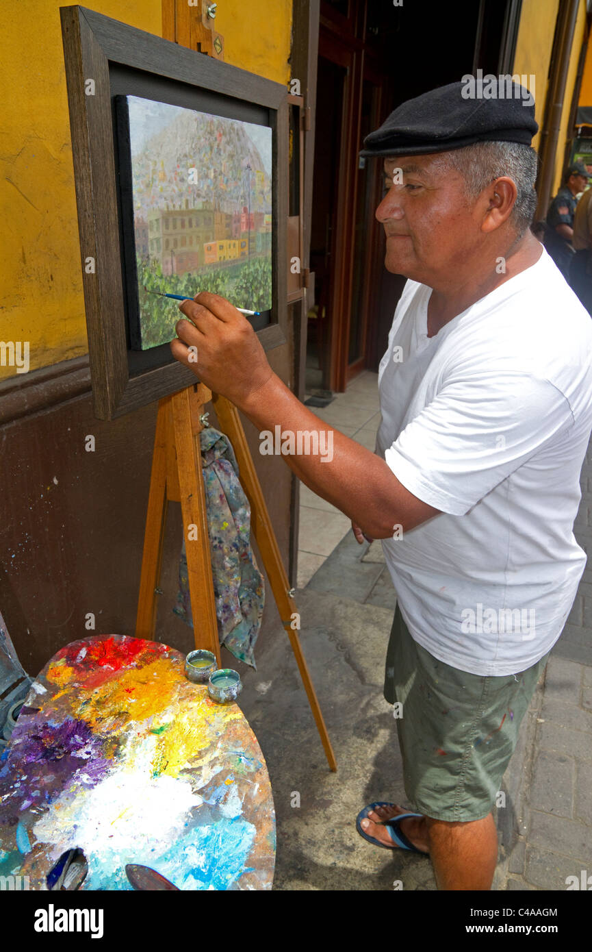 Artist painting in central Lima, Peru. Stock Photo