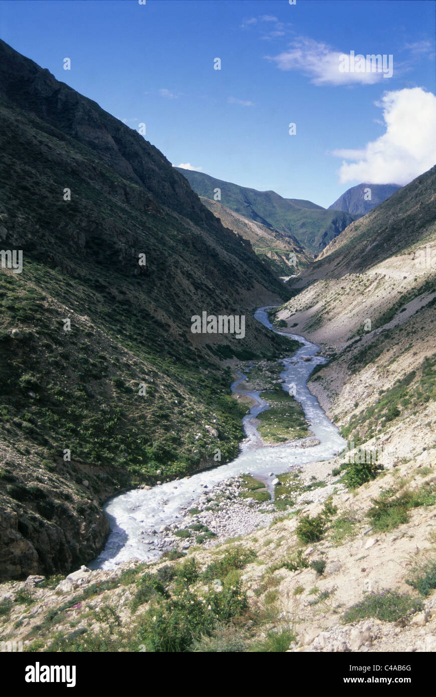 Photograph of a small stream in the bottom of a valley in Tibet Stock Photo