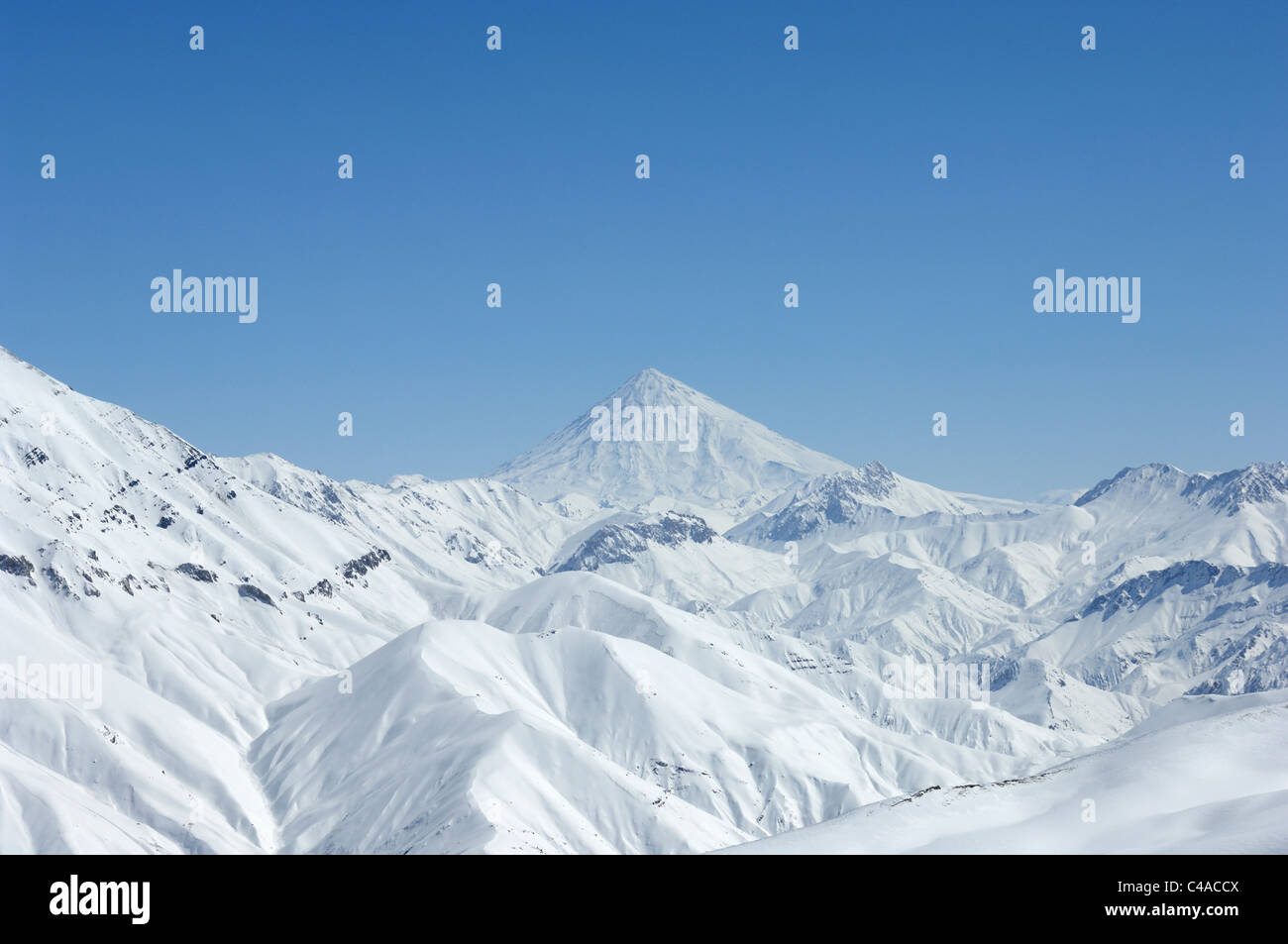 A snow covered Mount Damavand in the Alborz mountains of Iran Stock Photo