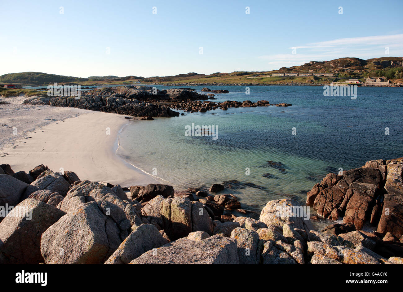 Sandy beach at Fidden on the Isle of Mull with Erraid in the distance Stock Photo