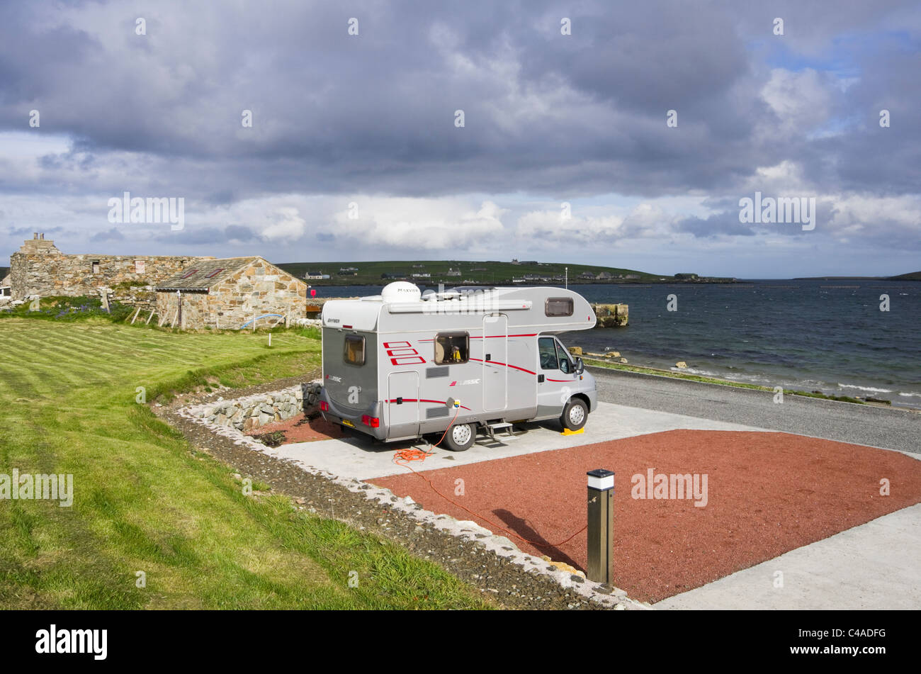 Uyeasound, Unst, Shetland Islands, Scotland, UK. Motorhome in Gardiesfauld youth hostel campsite by the sea. Stock Photo