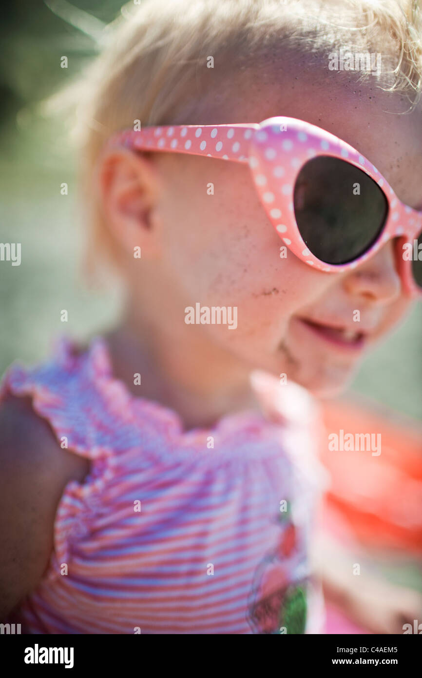 Toddler Girl wearing Sunglasses Smiling Stock Photo Alamy