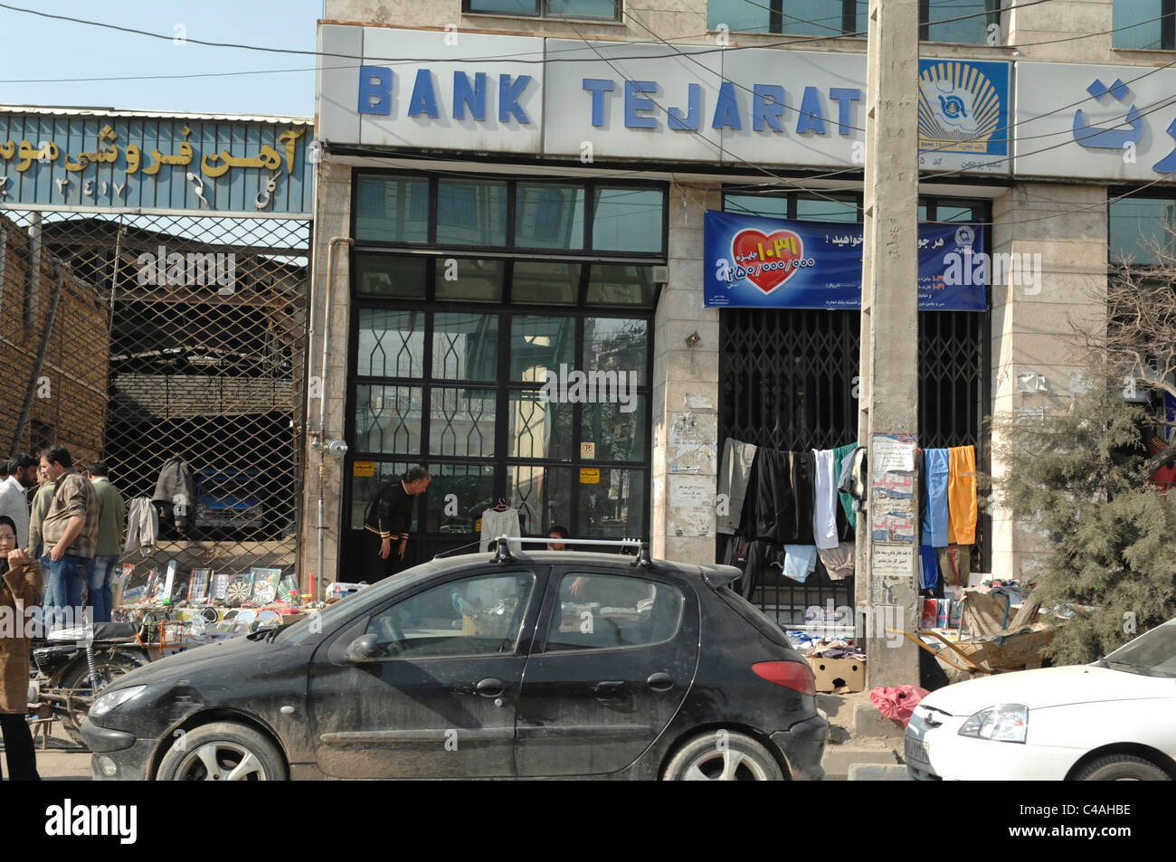 Shopping and retail grocery stores along the side of the road in Rudehen near Tehran in Iran Stock Photo