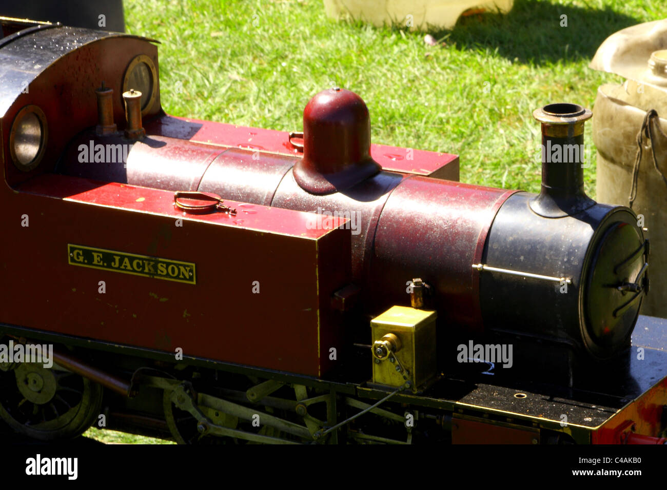 A model sit on steam train for rides at a local fair in the summer time. Stock Photo