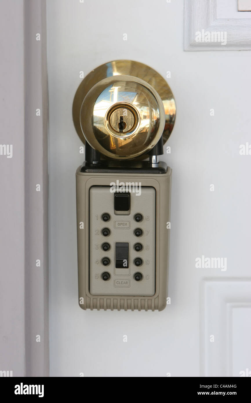 A real estate lock on the door to a house that is for sale Stock Photo Alamy