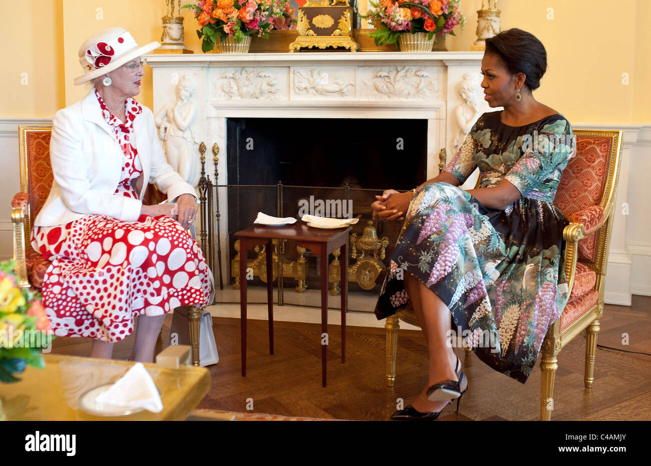 First Lady Michelle Obama has coffee with the Queen of Denmark Margethe II in the Yellow Oval Room of the White House. Stock Photo