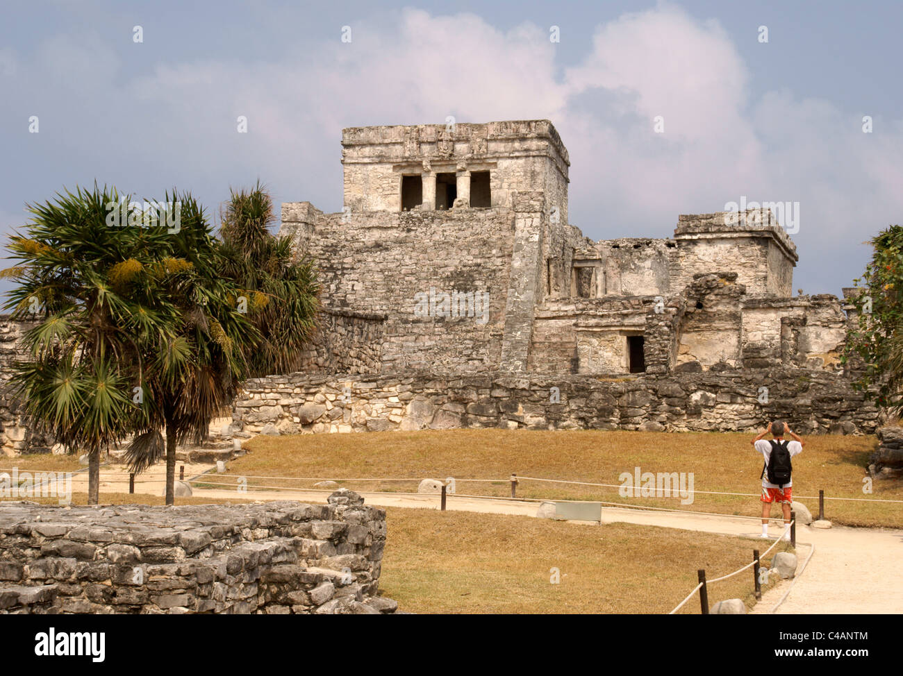 Tourist Photographing El Castillo At The Mayan Ruins Of Tulum On The 