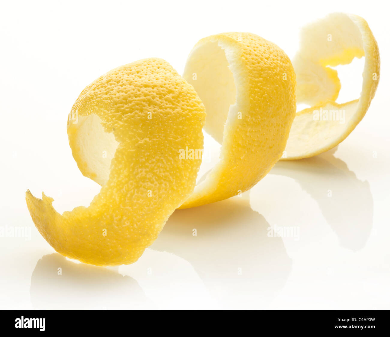 Twist of citrus peel on a white background. Stock Photo