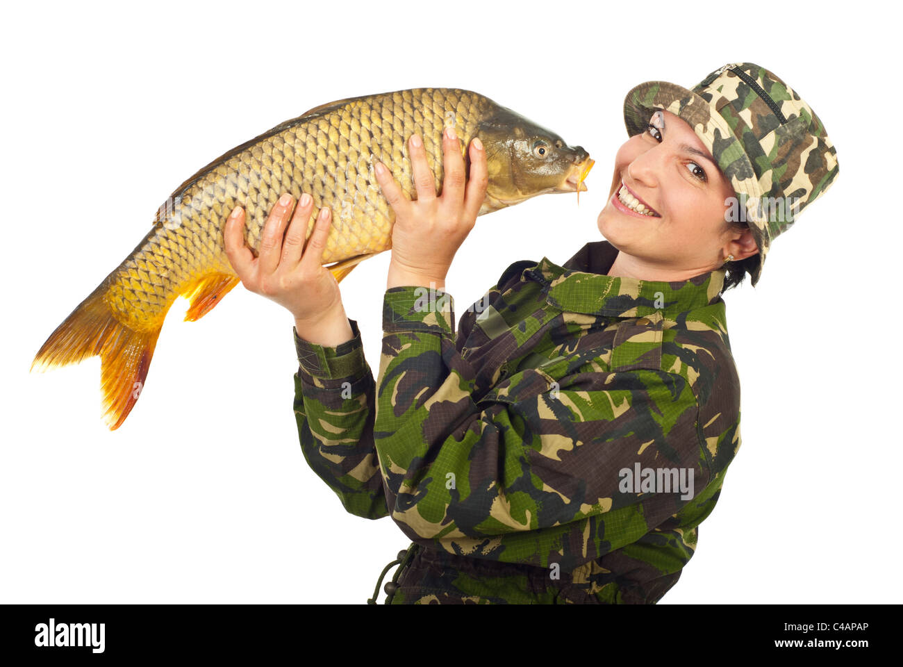Laughing fisher woman holding big fish isolated on white background Stock Photo