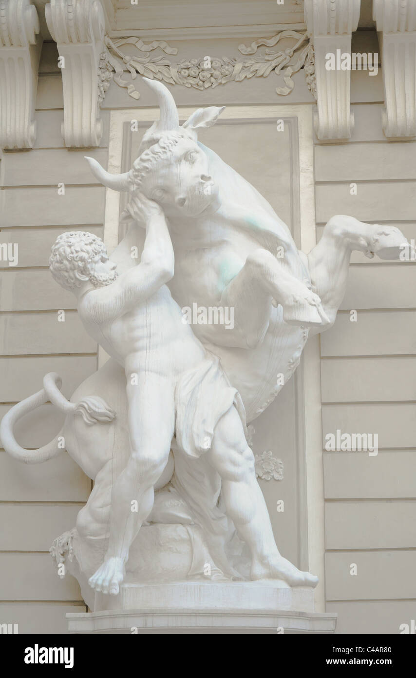 antique statue of a greek male god wrestling a bull Stock Photo Alamy
