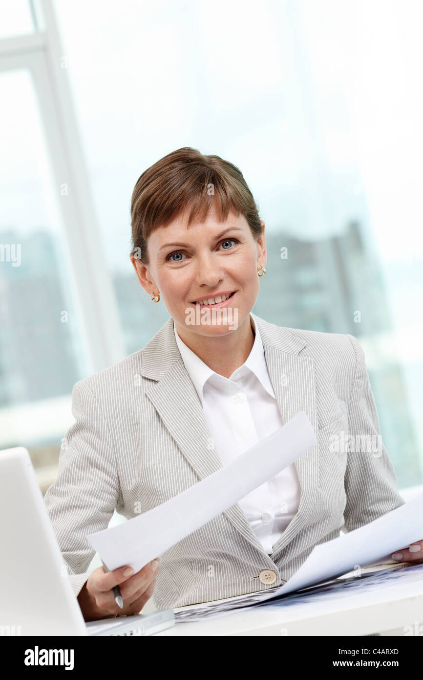 Portrait of smiling businesswoman looking at camera Stock Photo - Alamy