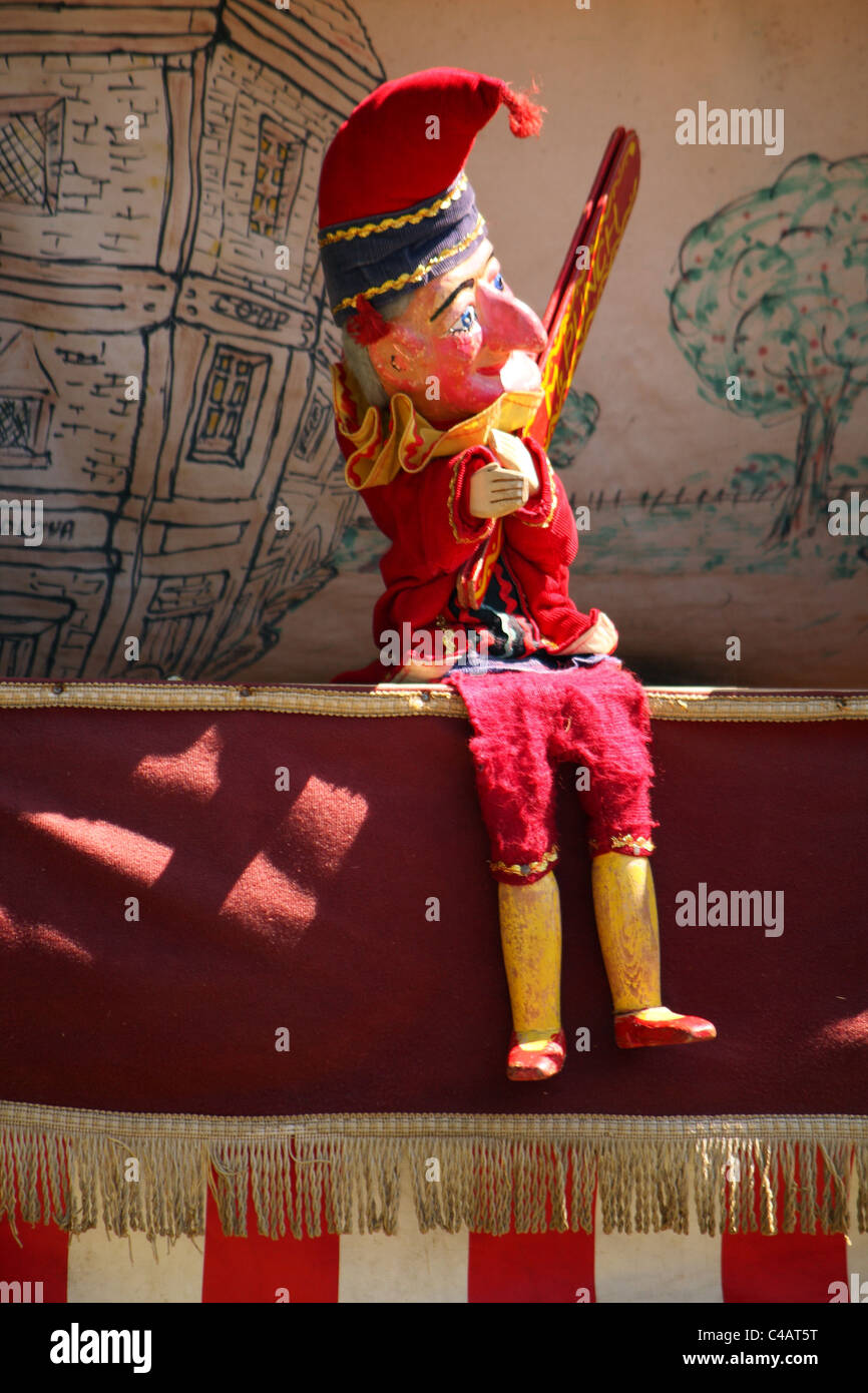 A Punch and Judy hand puppet seaside show for children on the beach in