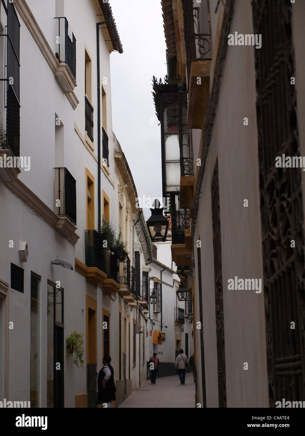 A narrow side street in a residential area of Cordoba, Spain. Stock Photo