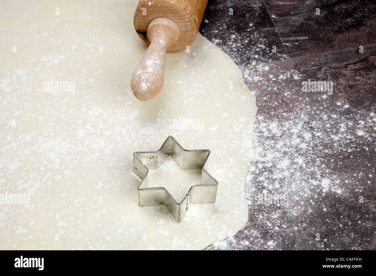 a rolled out dough for biscuits with flour Stock Photo Alamy