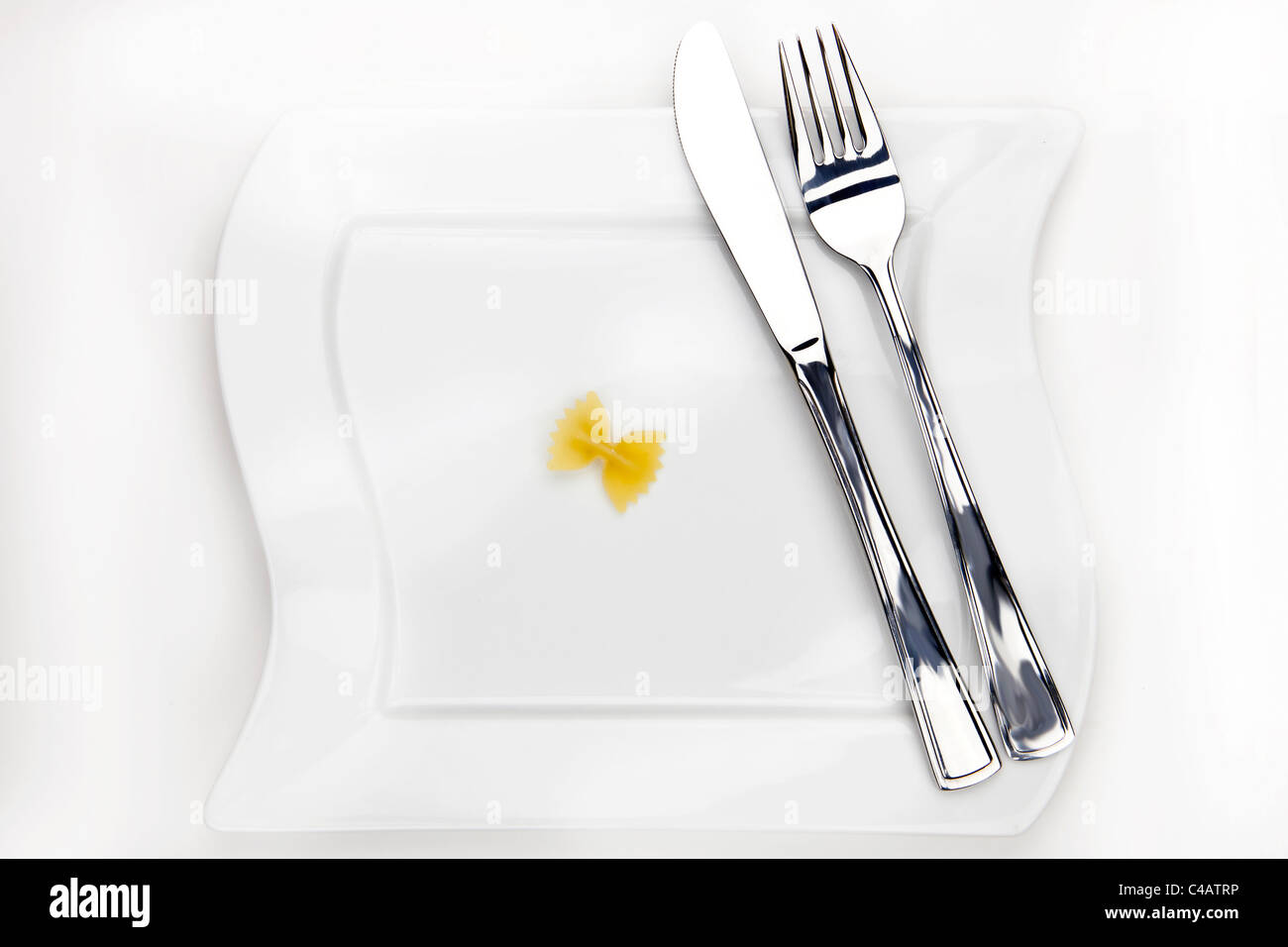 Farfalle one on a white plate Stock Photo