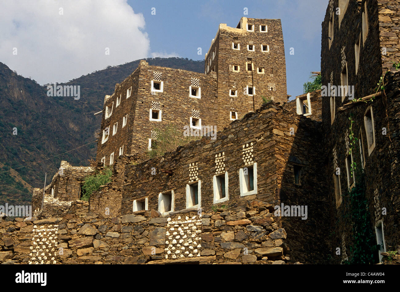 Saudi Arabia, Asir, Rejal- al-amaa. Standing in the Asir Mountains and recently part-restored, the village of Rejal al-Maa's Stock Photo