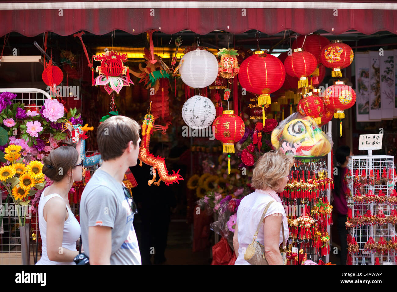 Singapore, Singapore, Chinatown. Tourists walk past Chinese New Year ...