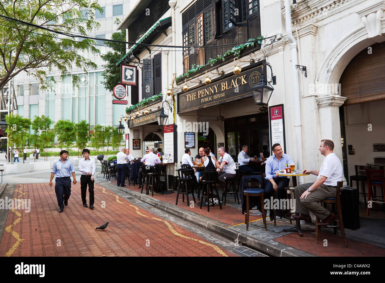 Singapore, Singapore, Boat Quay. City workers drinking at a British