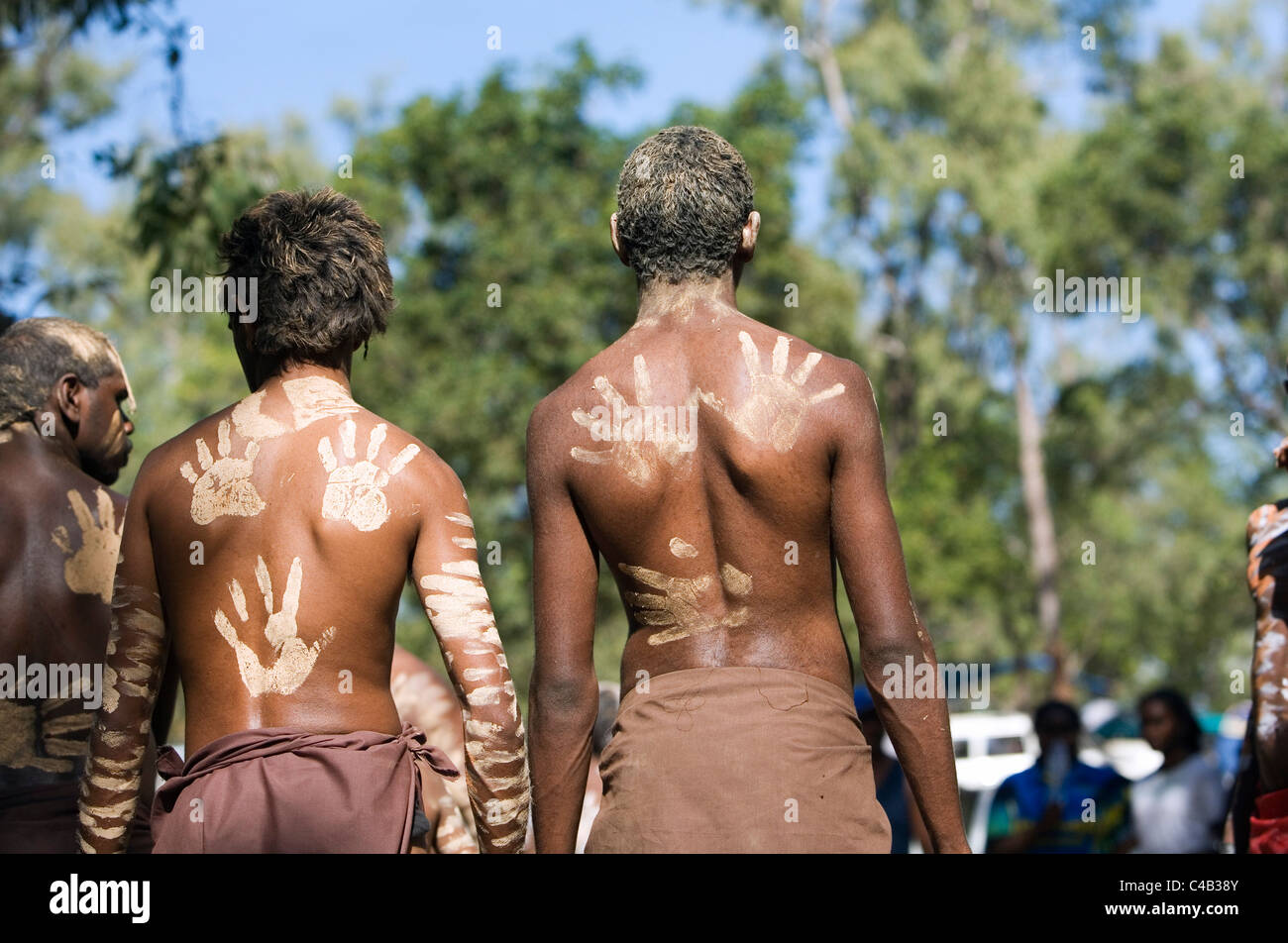 Australia, Queensland, Laura. Indigenous dancers with handprint decorations on back. Stock Photo