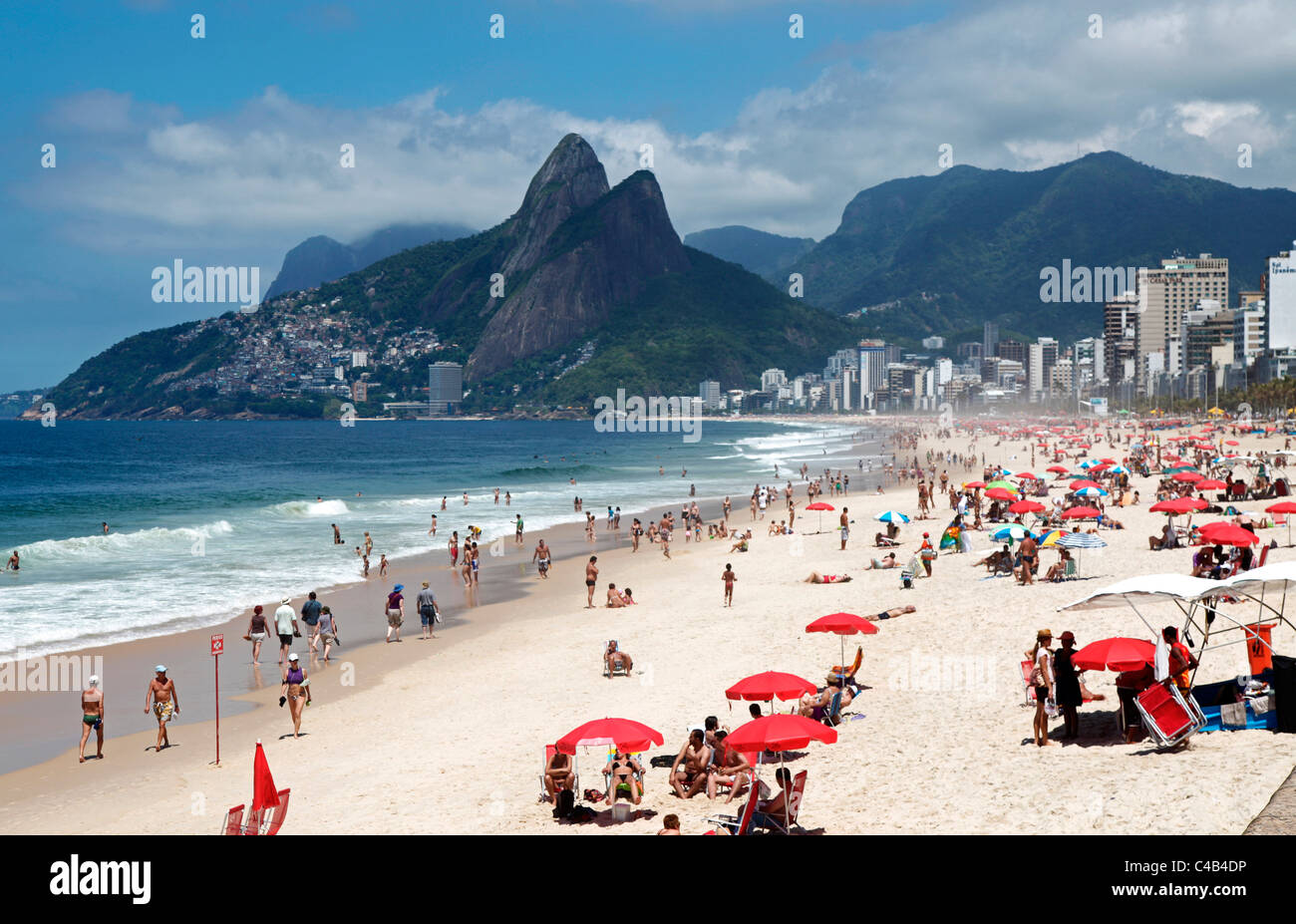 The famous Ipanema Beach in Rio de Janeiro with the Two Brothers Mountain in the background. Brazil Stock Photo