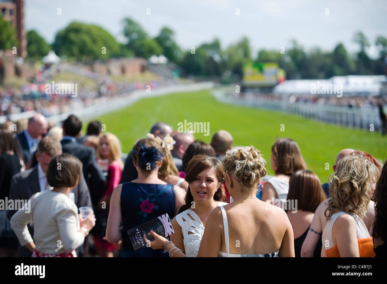 England, Cheshire, Chester. Spectators at Chester Racecourse Stock ...