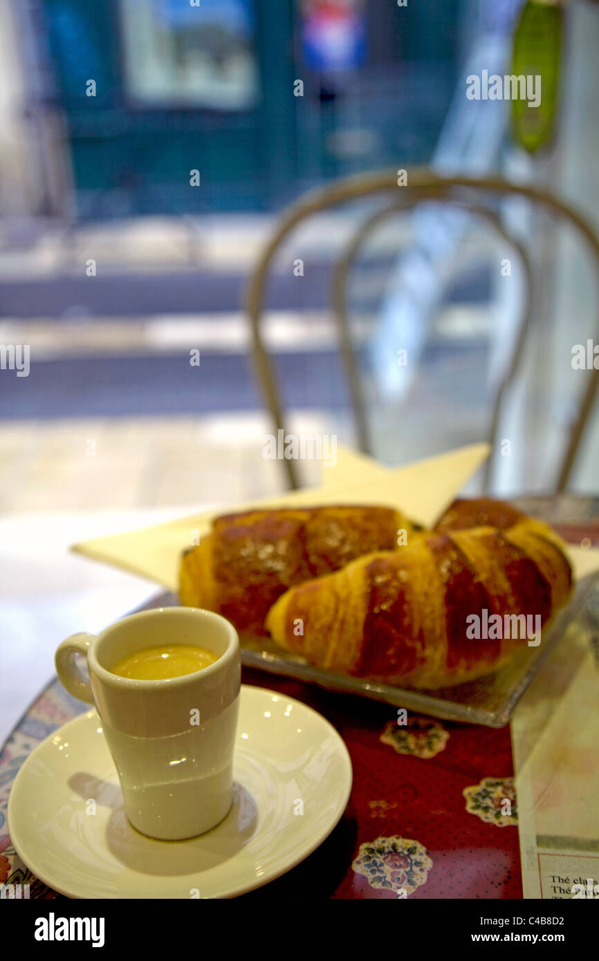 Arles; Bouches du Rhone, France; Coffee and Croissant in one of the cafes in the historical city Stock Photo