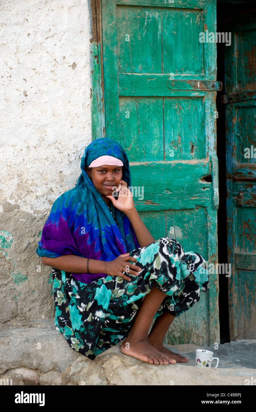 Woman outside her house, Berbera, Somaliland, Somalia Stock Photo