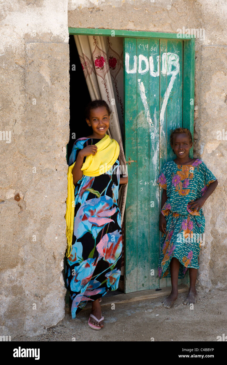 Girls outside their house, Berbera, Somaliland, Somalia Stock Photo