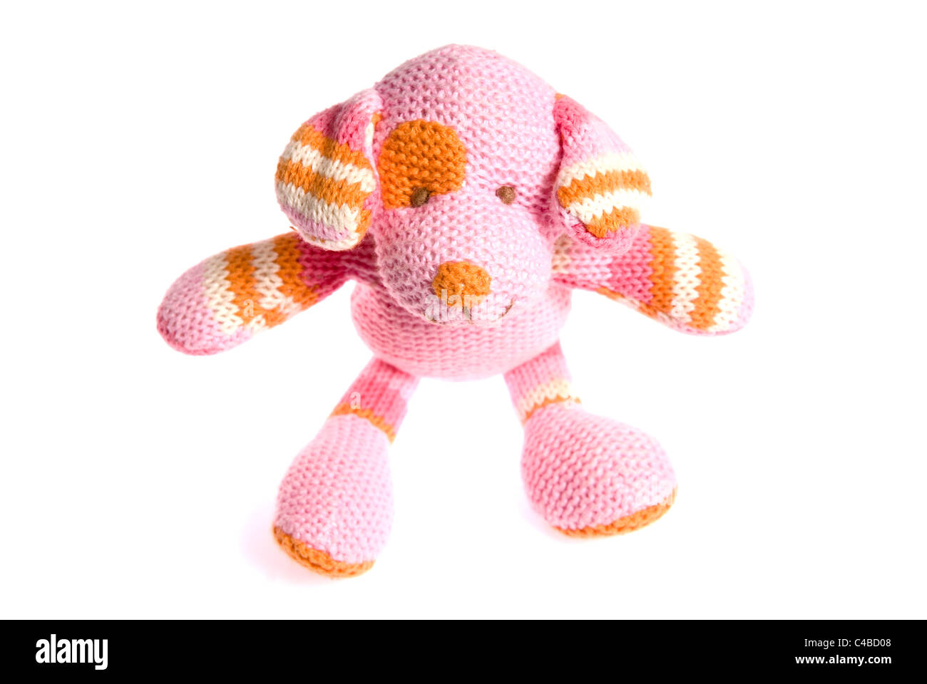Pink and orange soft cuddly plush toy dog isolated on a white background for cutout or space for text Stock Photo