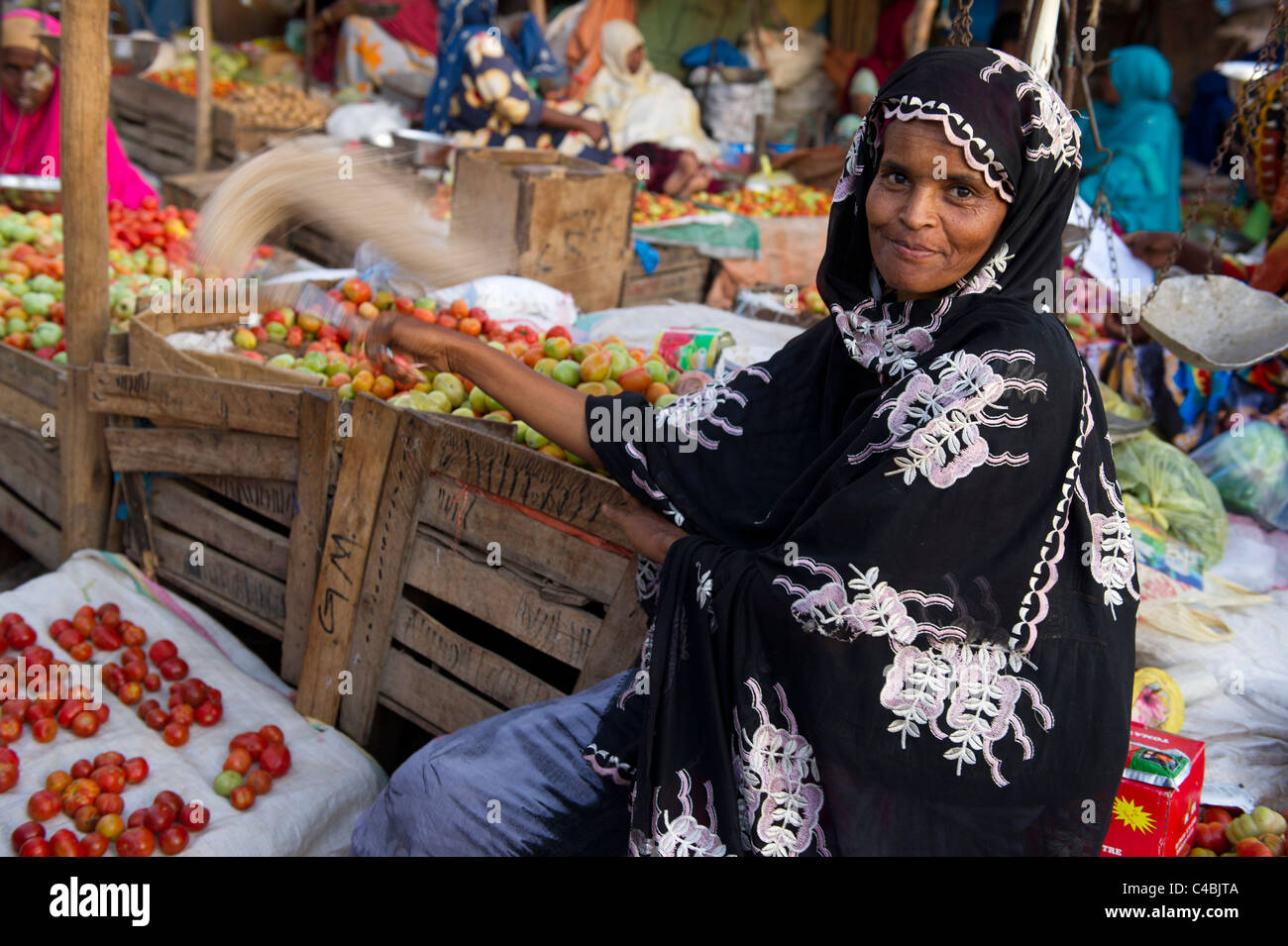 Woman selling tomatoes in the market, Hargeisa, Somaliland, Somalia Stock Photo
