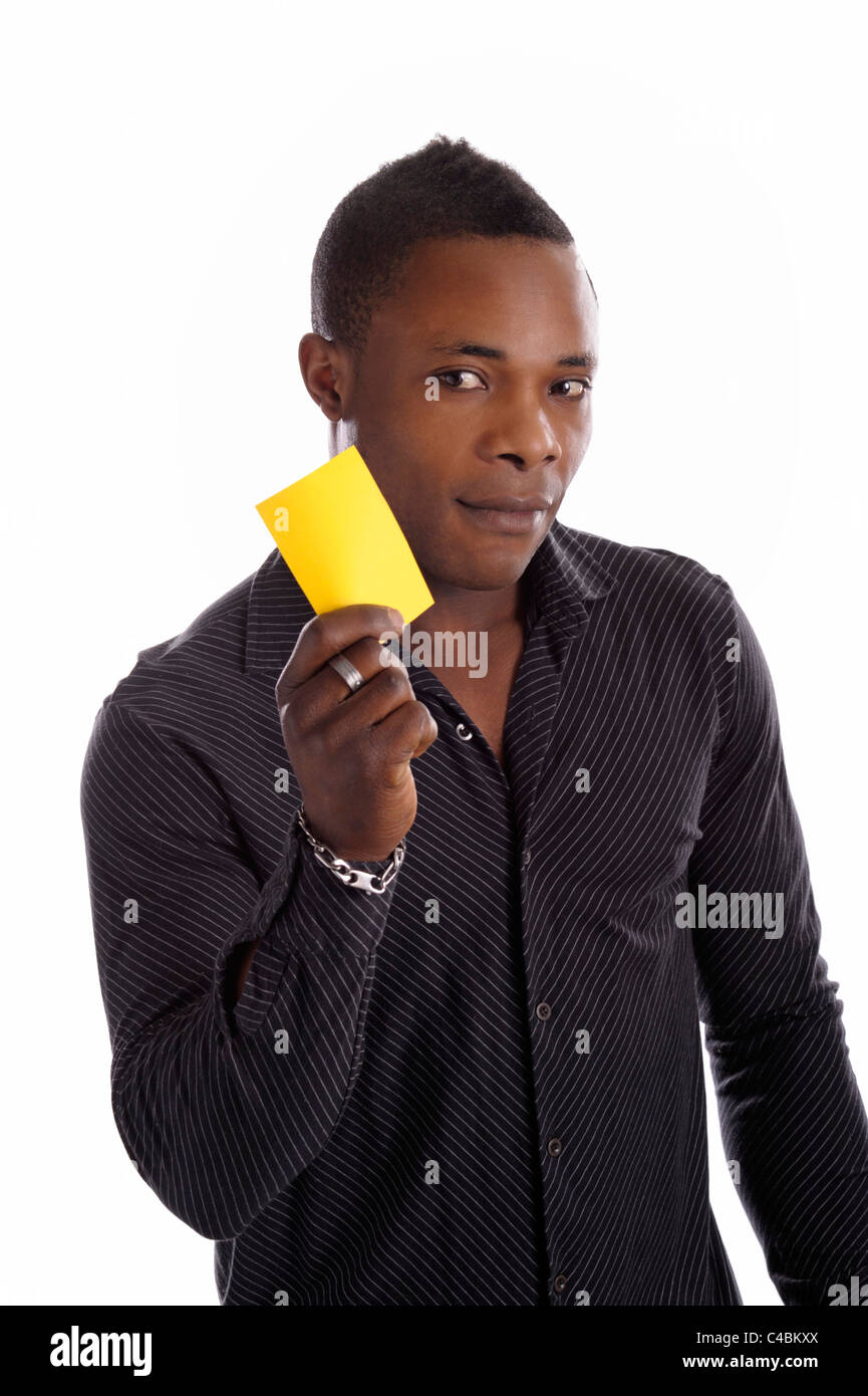 young black man with yellow card in his hands. isolated on white Stock