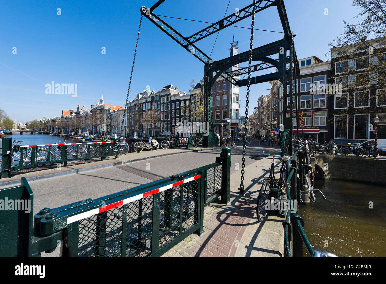 Bridge over the Kloveniersburgwal canal at the end of Staalstraat in the city centre, Amsterdam, Netherlands Stock Photo