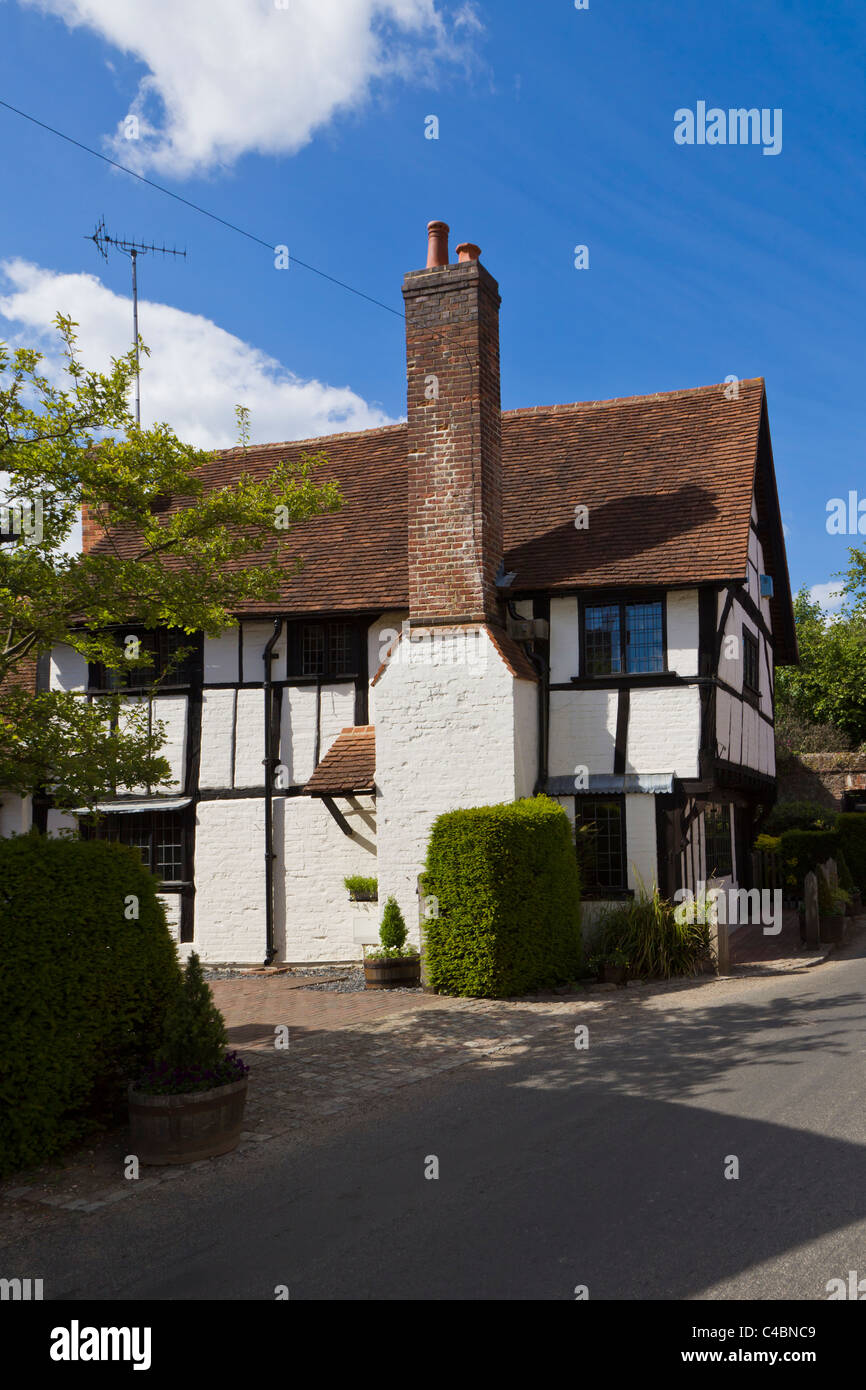 A timber framed house with traditional white walls in Shere, Surrey, England Stock Photo