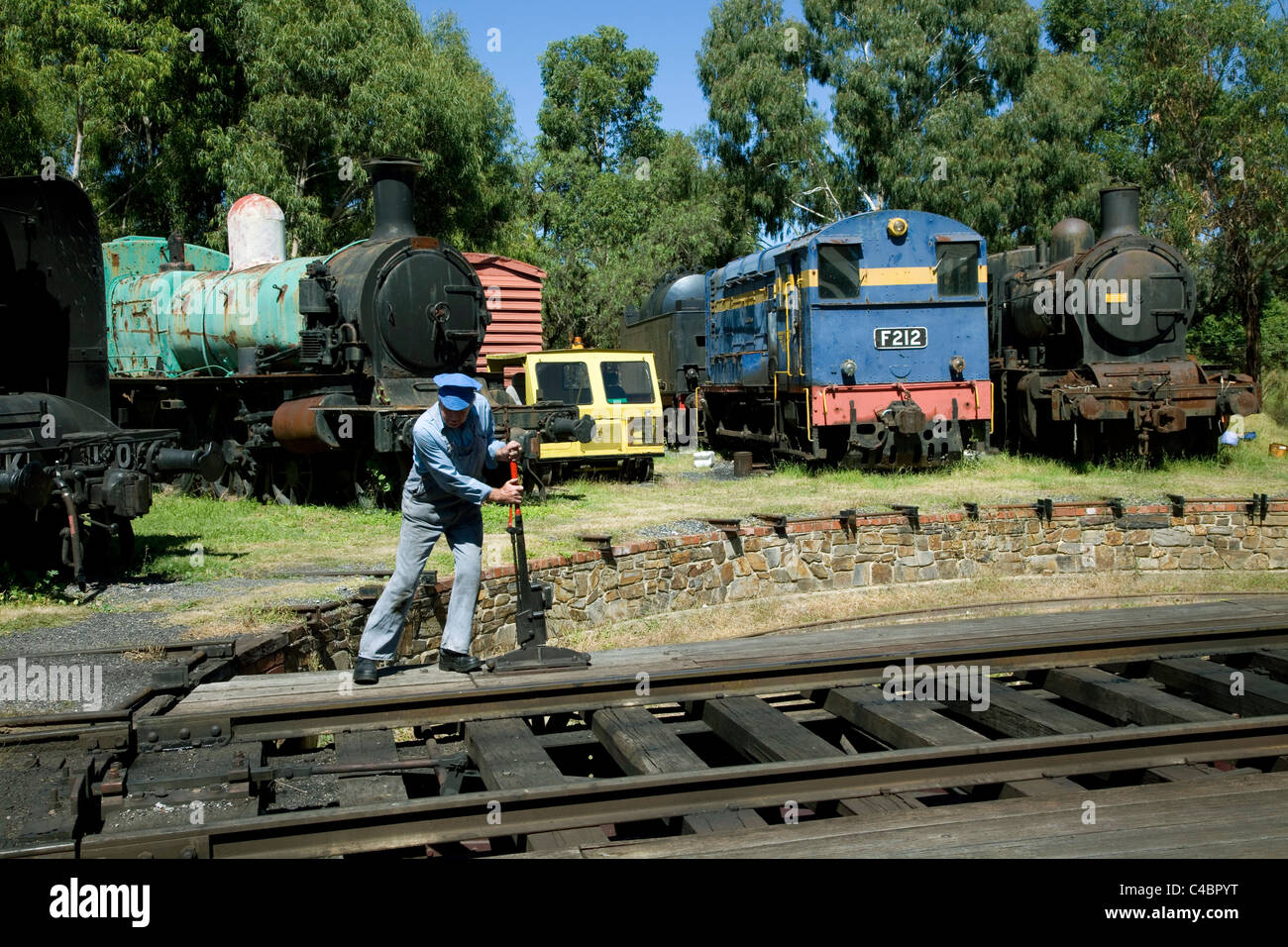 Operator moving the turntable at Maldon Railway Station, Maldon, Victoria, Australia Stock Photo