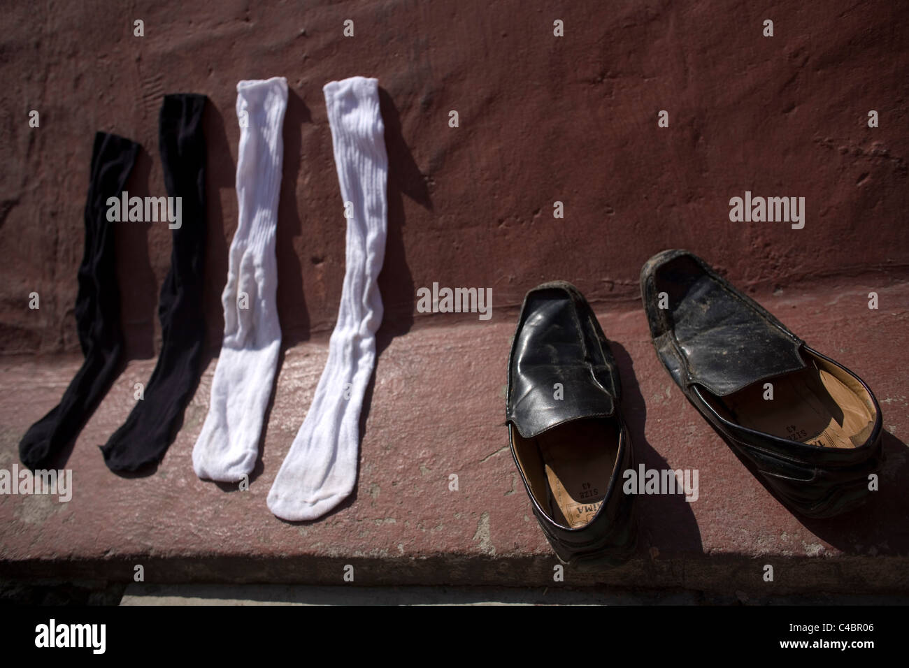 Shoes and socks of an undocumented Central American migrants located along the railroad in Mexico City Stock Photo