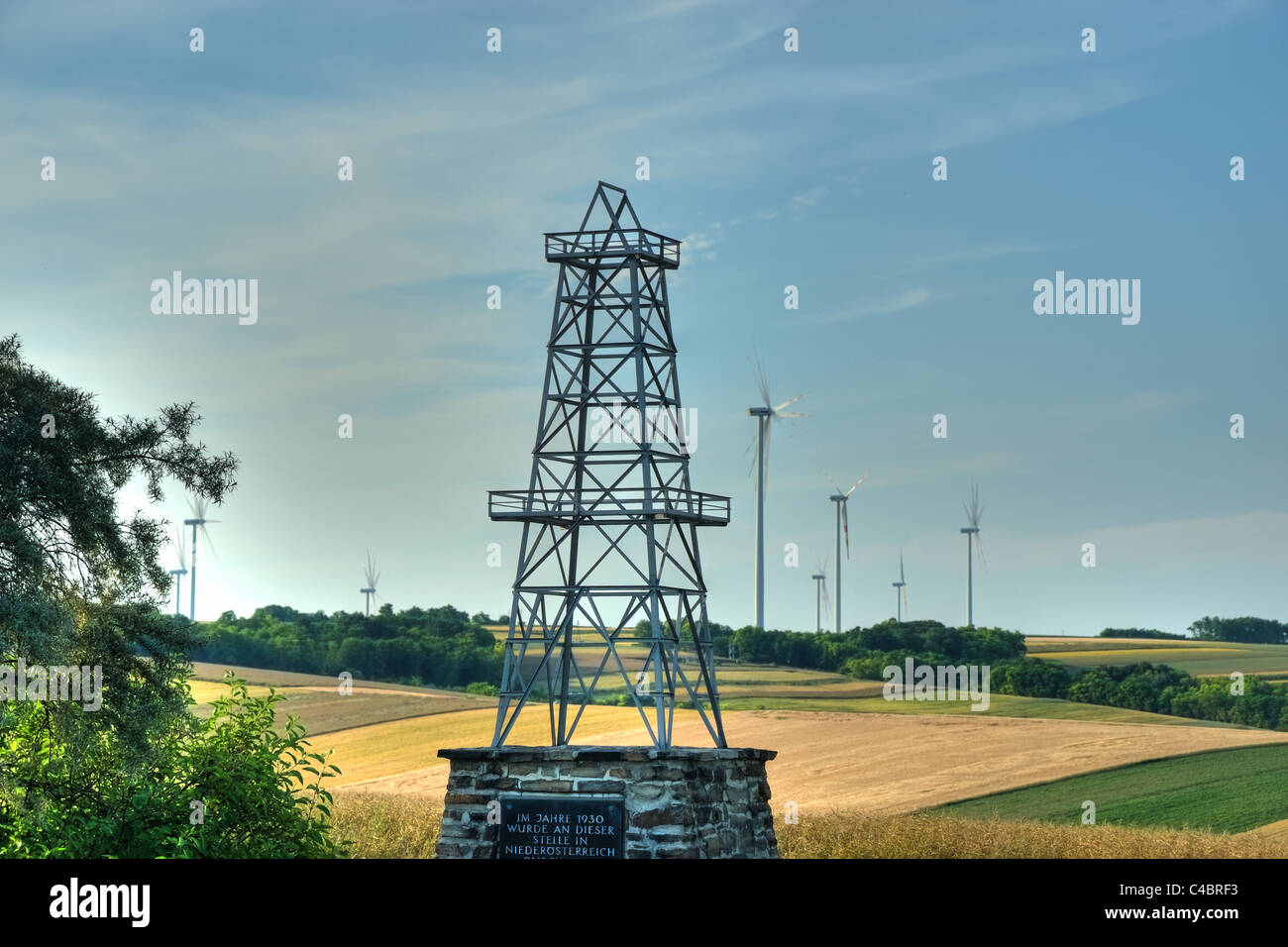 Austria, historic Oil Monument and Windmills in the Background Stock Photo