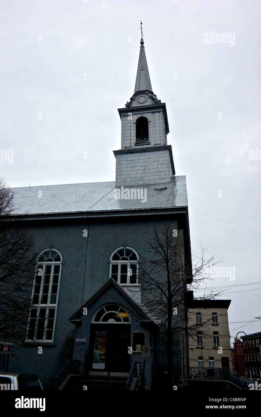 Crooked Church with leaning spire bell tower Saint-Roch district Quebec City in rain Stock Photo