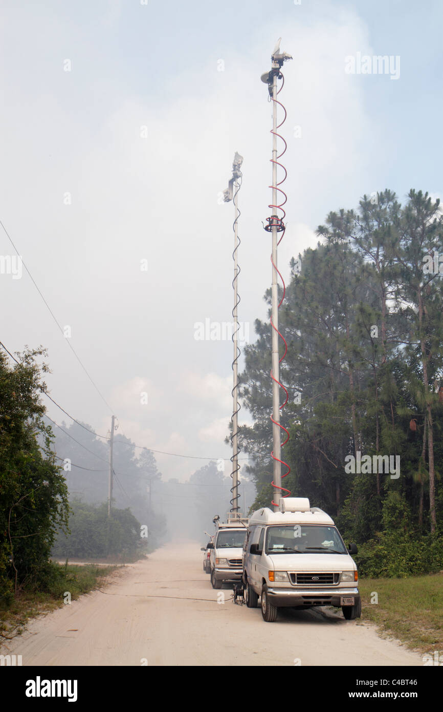 Deland Florida,forest fire,smoke,smoky,media,mobile transmission van,news,television,set,live reporting,tower,visitors travel traveling tour tourist t Stock Photo
