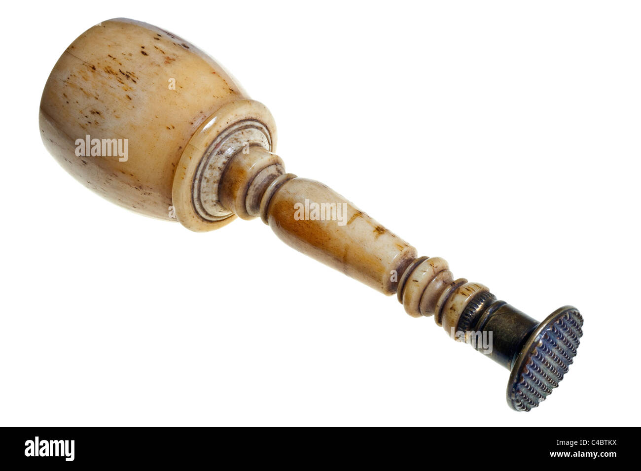Antique turned bone or ivory and brass sealing wax impression tool photographed against a pure white background. JMH4977 Stock Photo