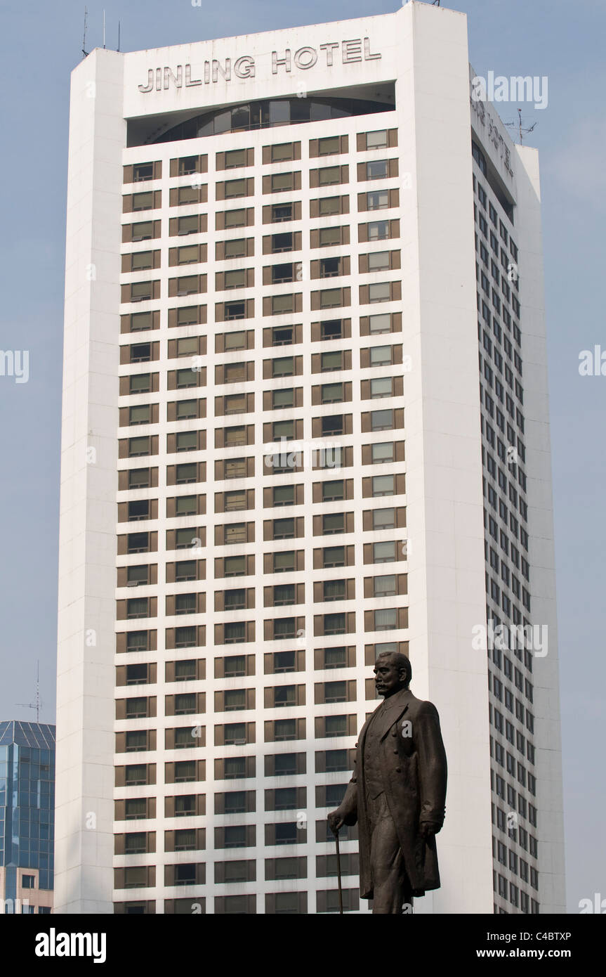Statue of Dr. Sun Yat-sen in the central of Nanjing. Jinling hotel in the background. Stock Photo