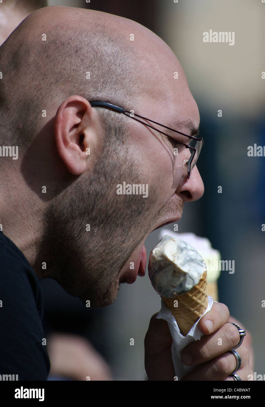 Bald man eating ice cream hi-res stock photography and images - Alamy