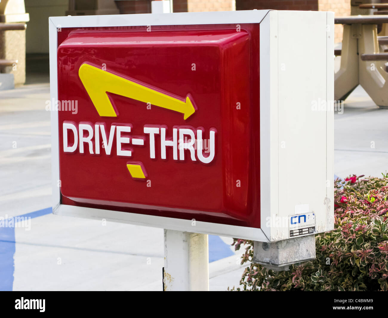 A sign indicating the drive-thru lane at an IN-N-Out Hamburger store in California Stock Photo