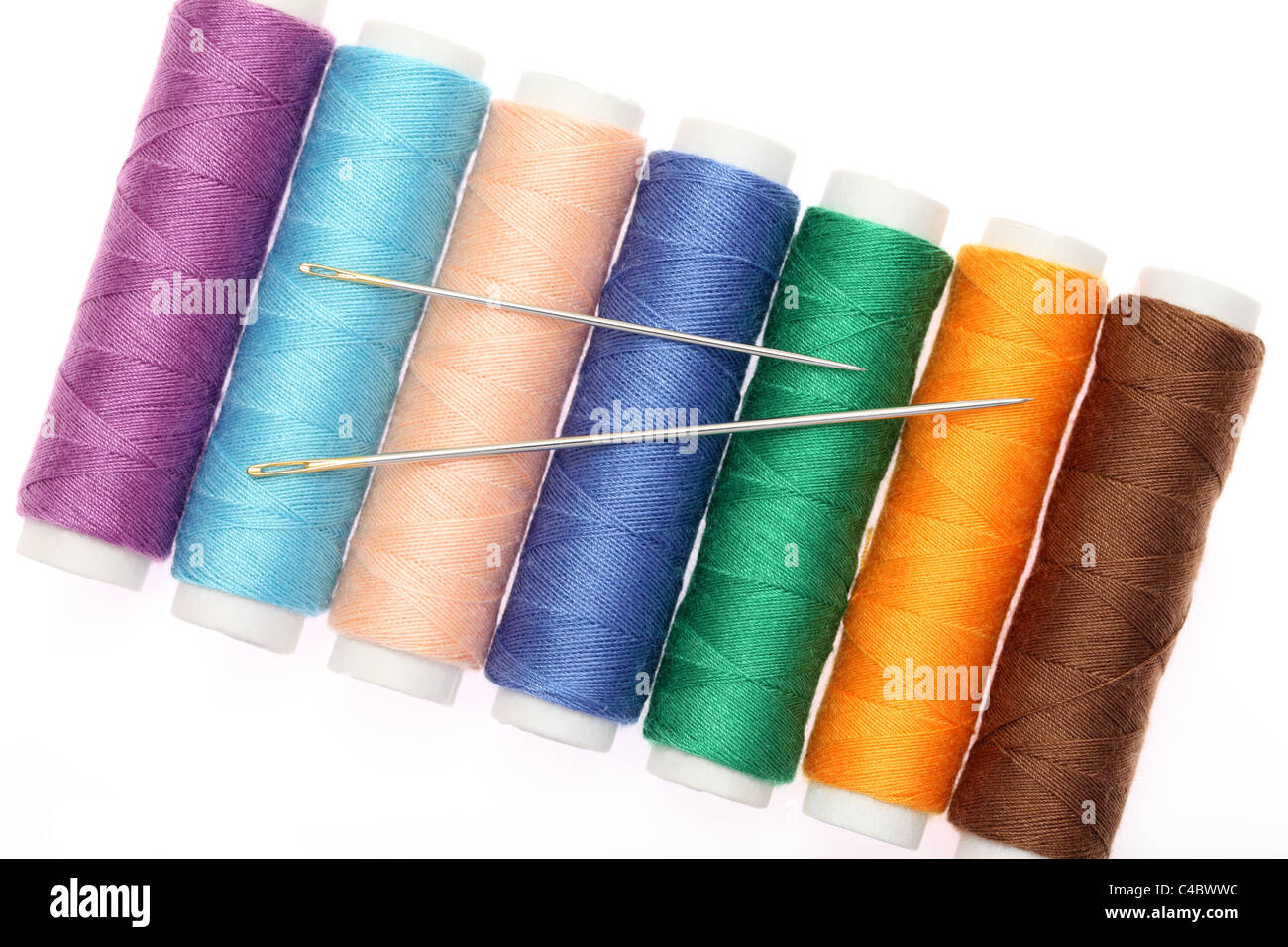 Needle and thread isolated on white background Stock Photo