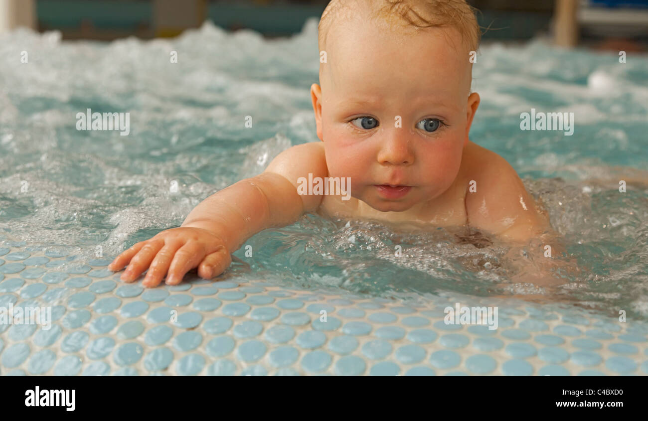 Baby boy (6 months old) in a swimming pool Stock Photo Alamy